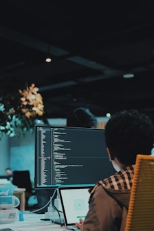 boy in front of computer monitor