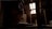 A dimly lit attic space with wooden beams and a partially visible roof letting in natural light through a small window. A person is sitting on a wooden surface, silhouetted against the light.