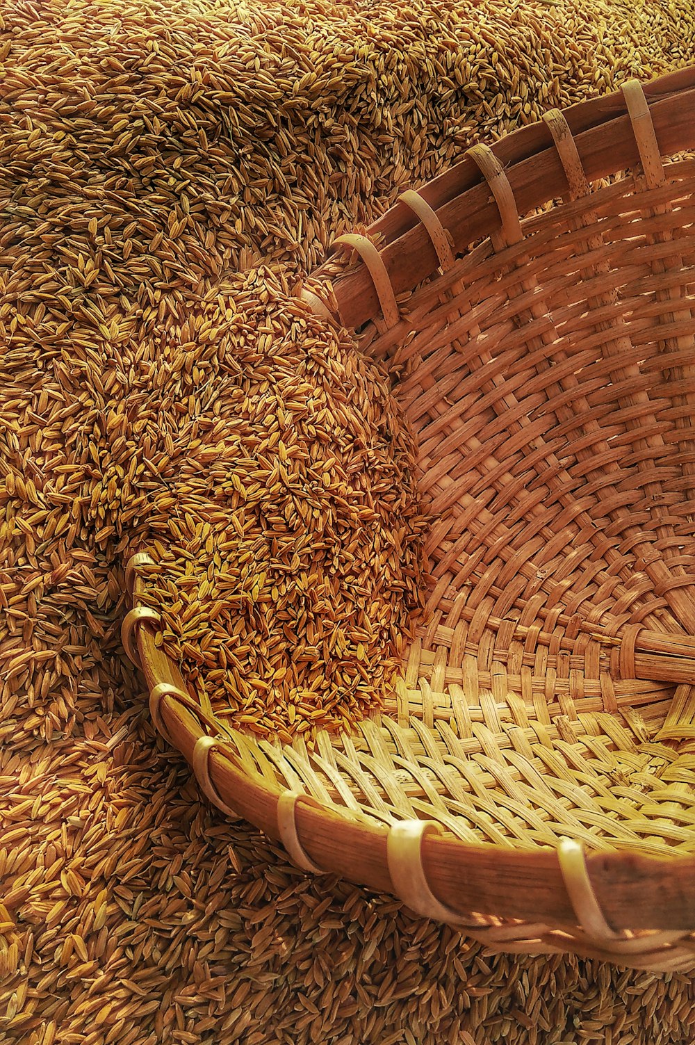 wicker basket on rice grains