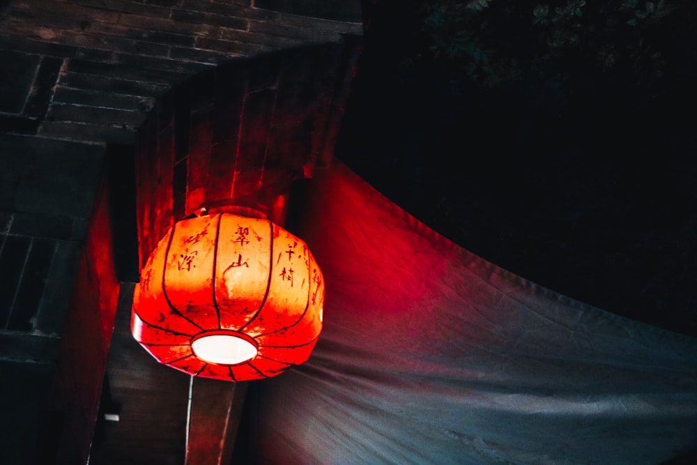 turned-on red paper lantern