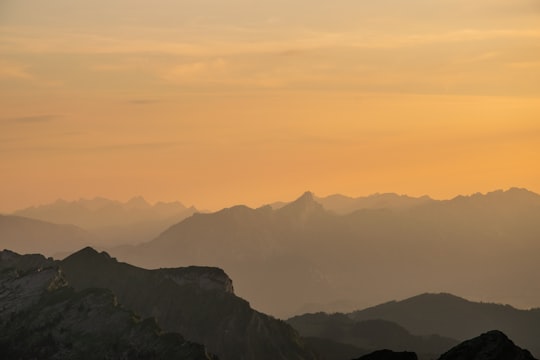 sunrise over mountains during foggy day in Hohgant Switzerland