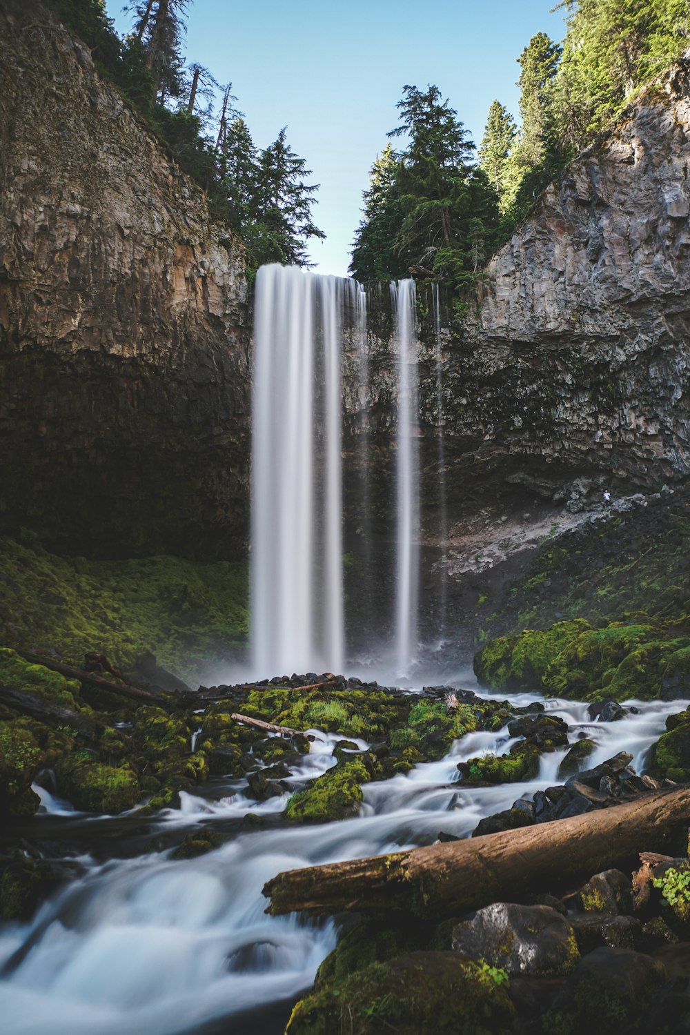 waterfalls under blue sky