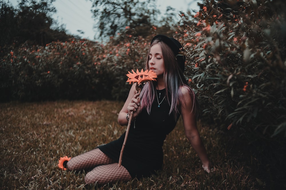 woman sitting on ground