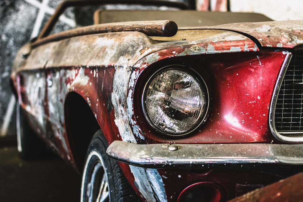 close-up photo of rusted red and brown vehicle