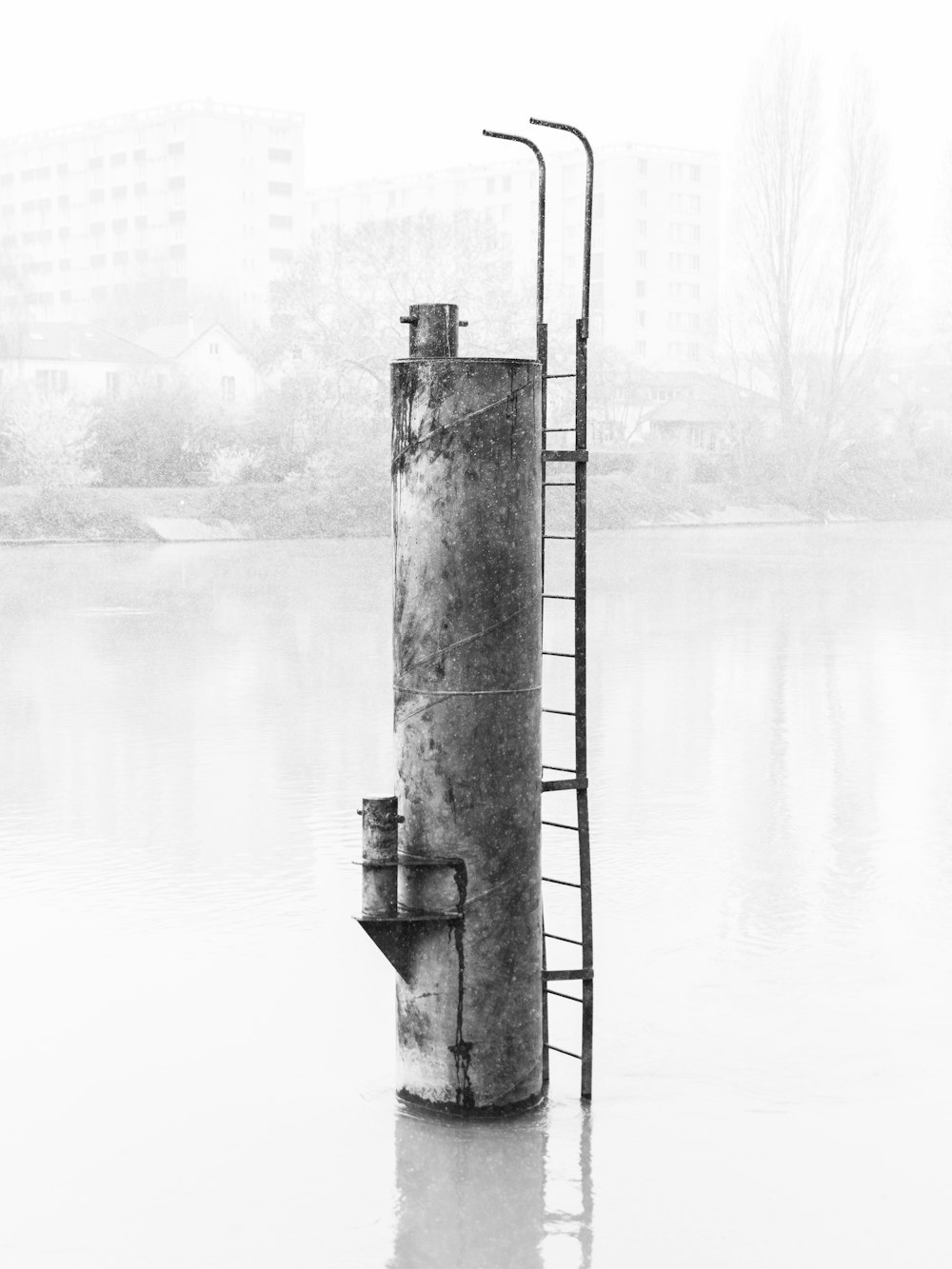 gray metal tank with ladder