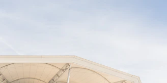 Close-up of the stage roof structure showing sturdy metal framing and waterproof cover.