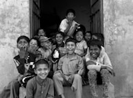 Children learning and laughing during a cultural education program supported by the Federation.