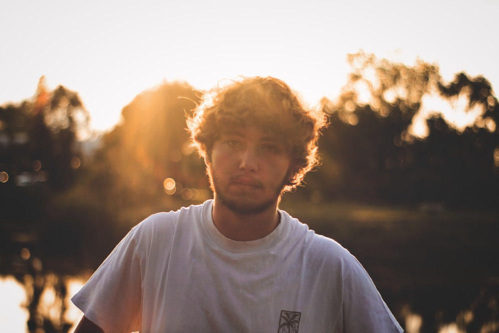 man wearing white crew-neck t-shirt