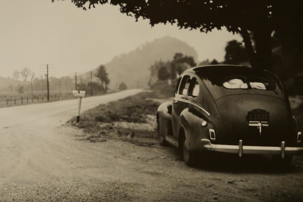 sepia photo of vehicle on roadside