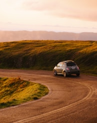 gray 3-door hatchback on road