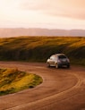 gray 3-door hatchback on road