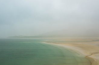 ocean waters beside coastline