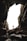 man standing on cave