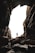 man standing on cave