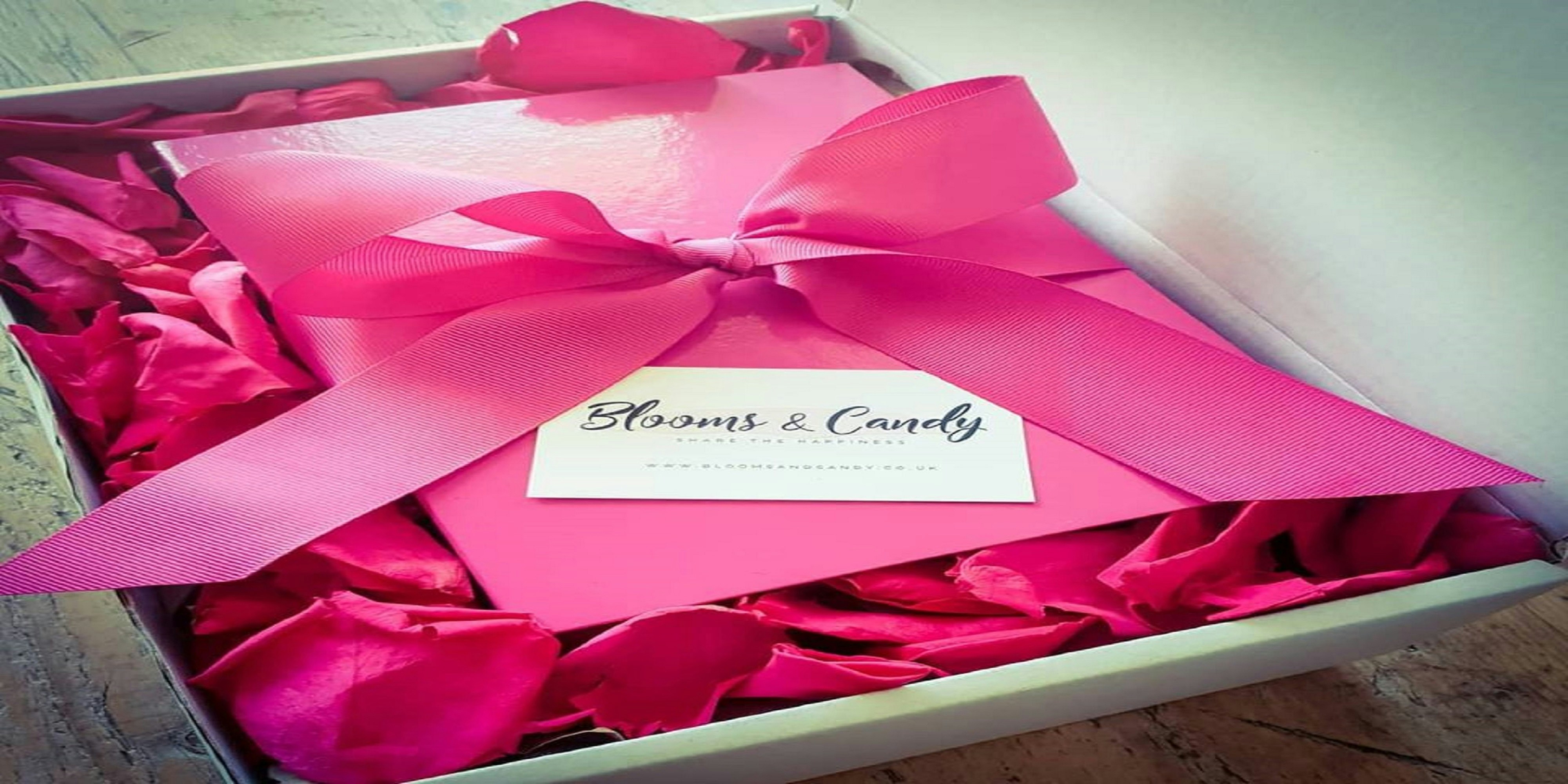 Midnight delivery luxury gift box with candles rose petals dark romantic atmosphere