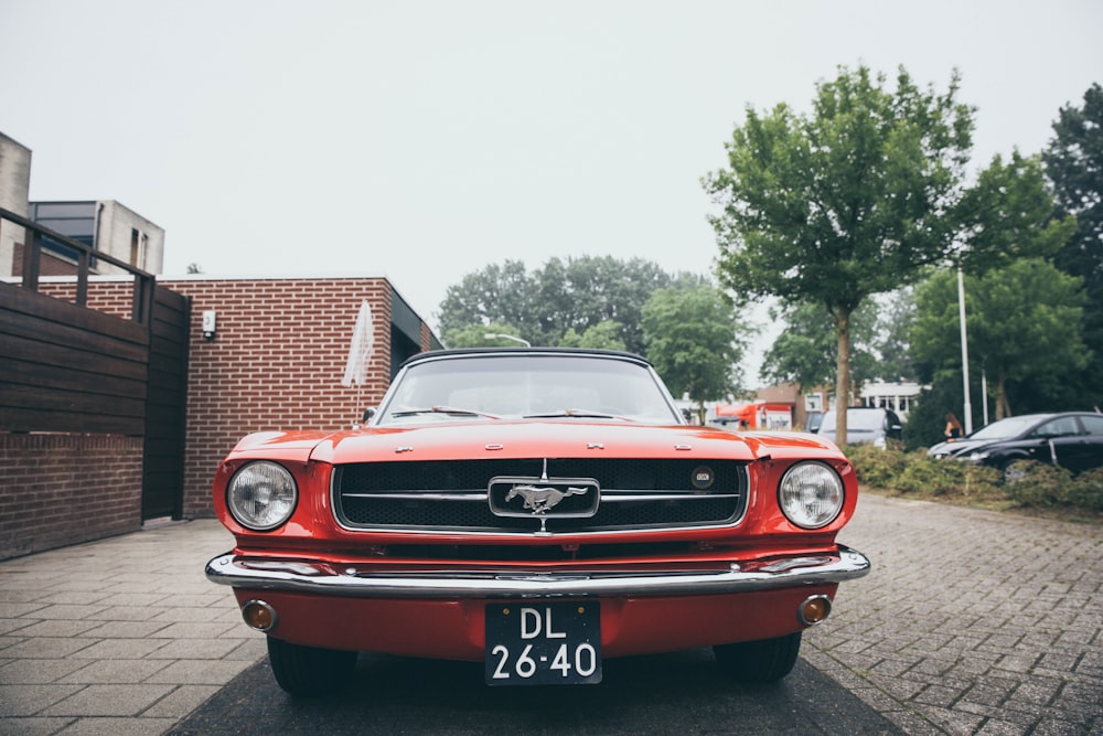 parked red Ford Mustang muscle car