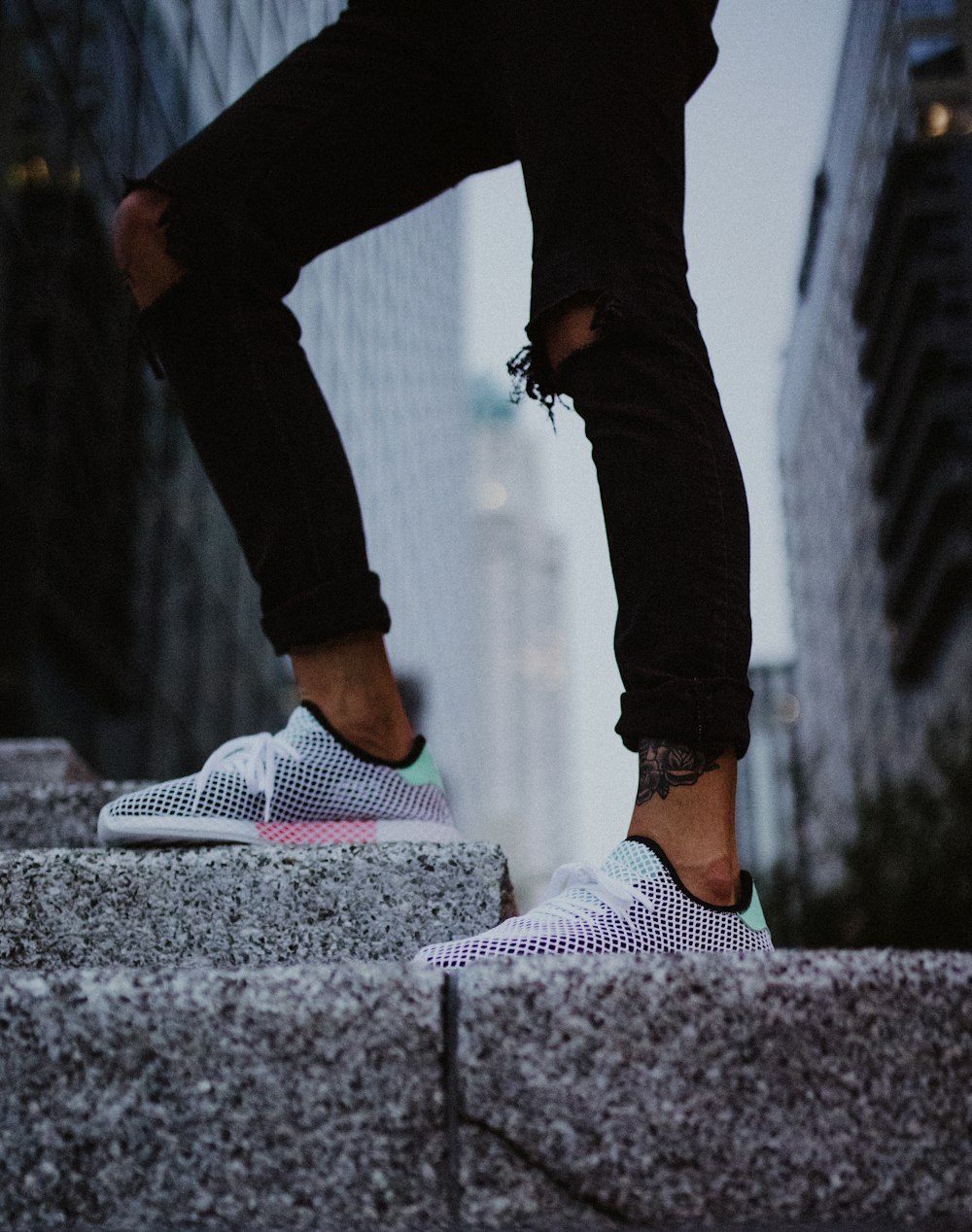 a person standing on top of a cement step