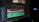 A computer screen displays a video editing software interface with multiple tracks visible in the timeline. The timeline includes video and audio tracks, colored in pink, green, and blue, indicating different layers or elements. The software has various tools and menus around the timeline.