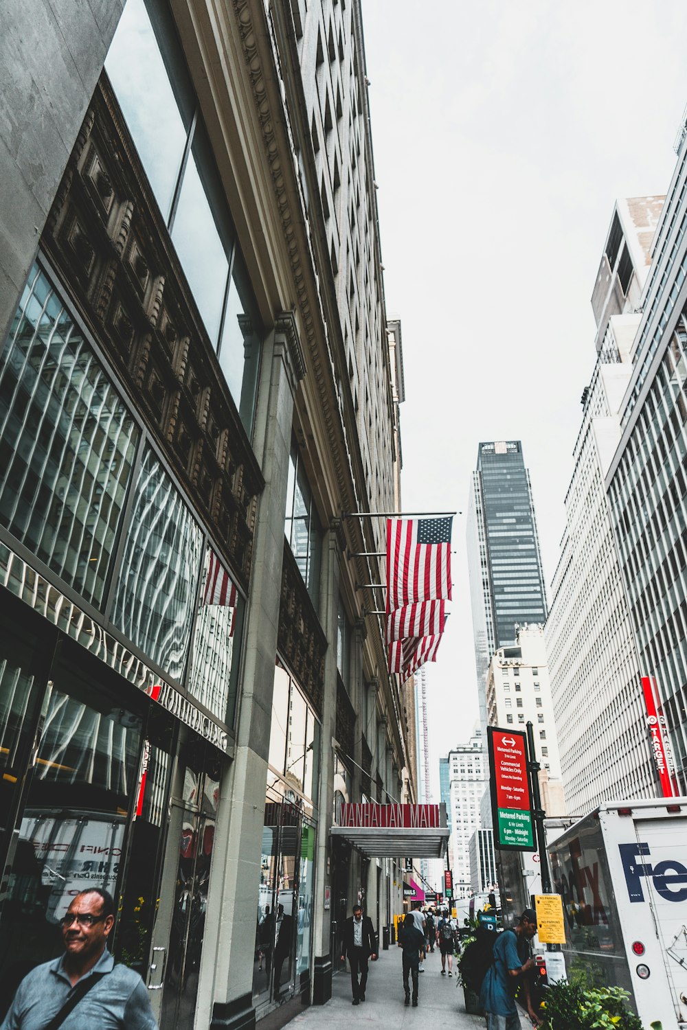 people walking near high-rise building