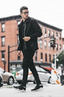 man walking beside the road