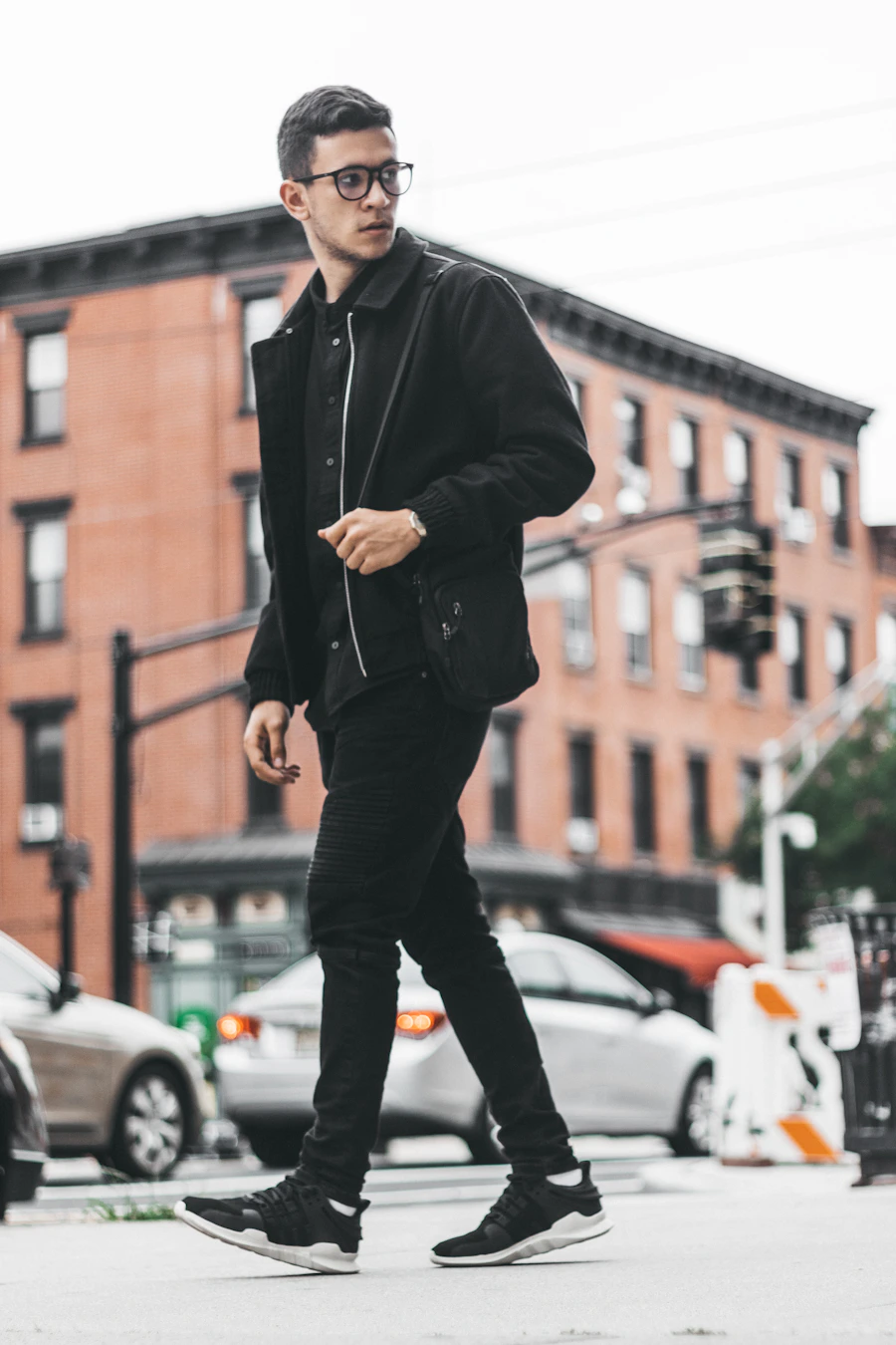 A chunky rubber-soled leather loafer photographed on wet pavement