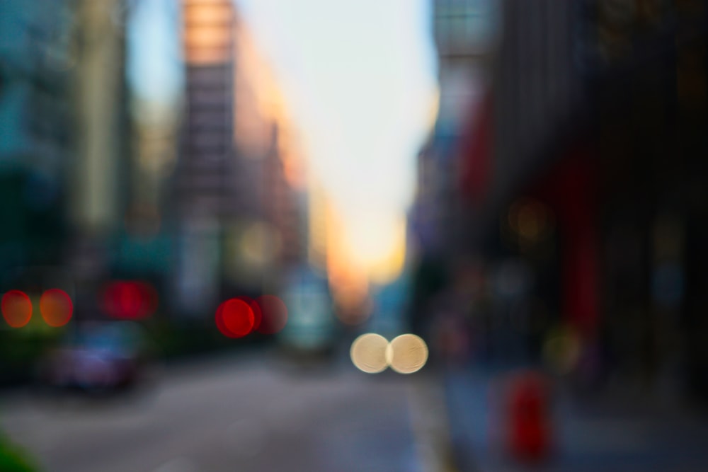 a blurry photo of a city street with buildings in the background