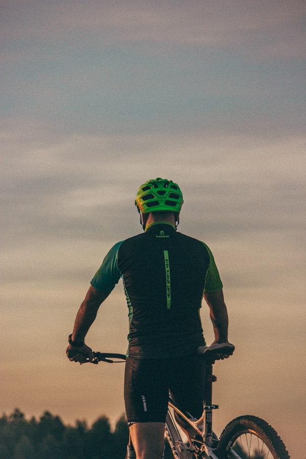 man riding bicycle during day timeby Andrei J Castanha