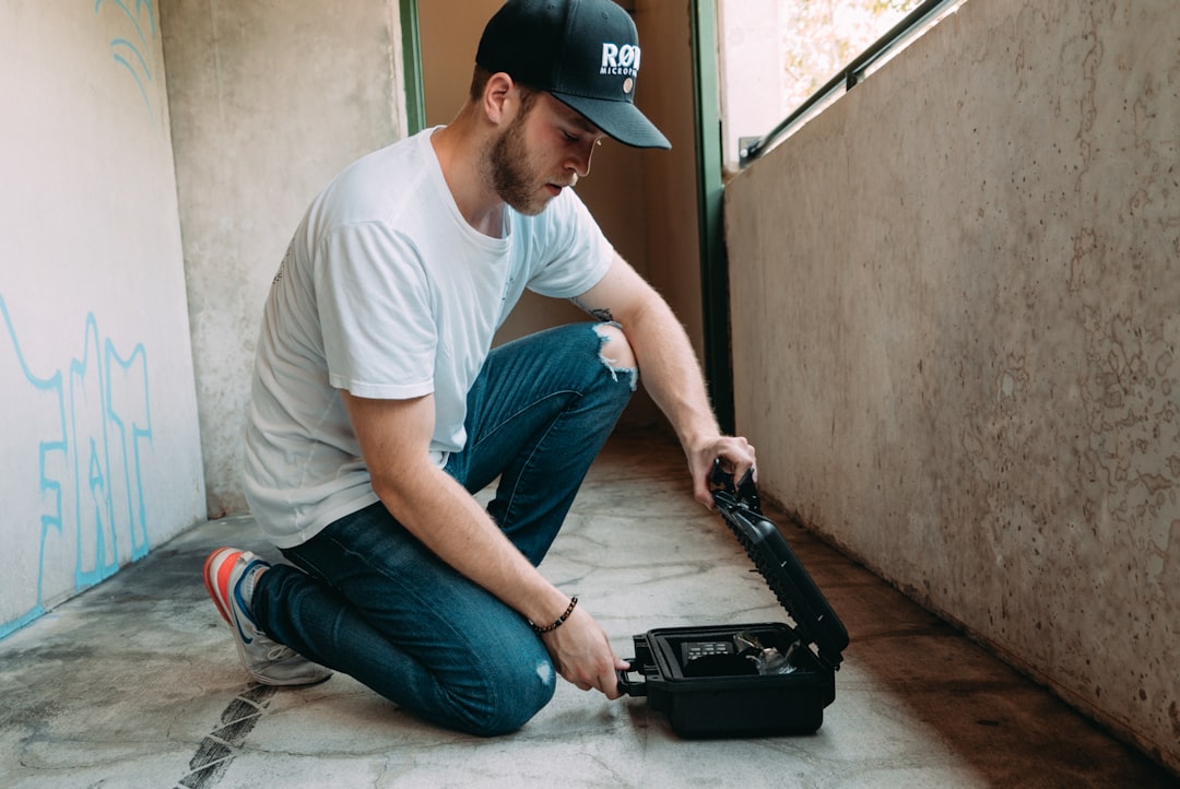 man holding black case