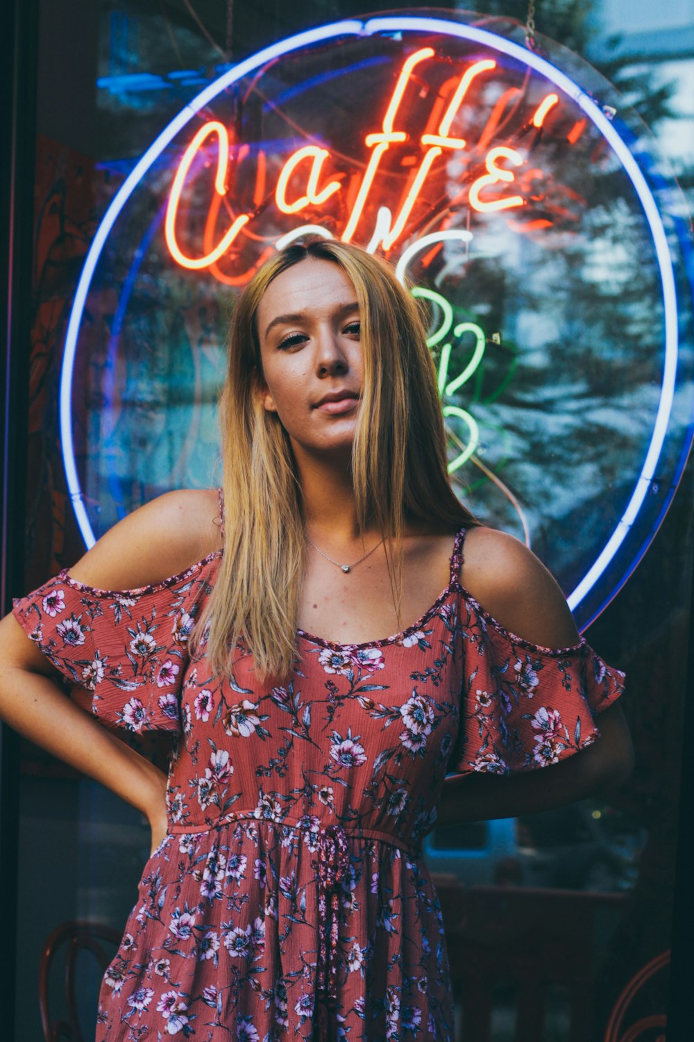 woman standing in front of caffe