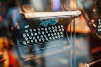 selective focus photography of black typewriter