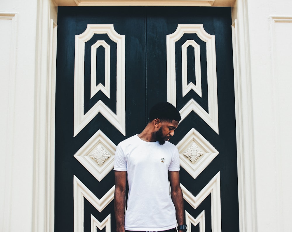 photo of man standing behind door