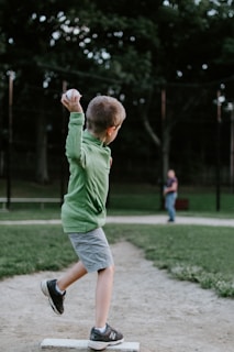 boy about to throw ball outdoors