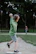 A middle school student throwing a baseball with motion sensors attached to the arm.