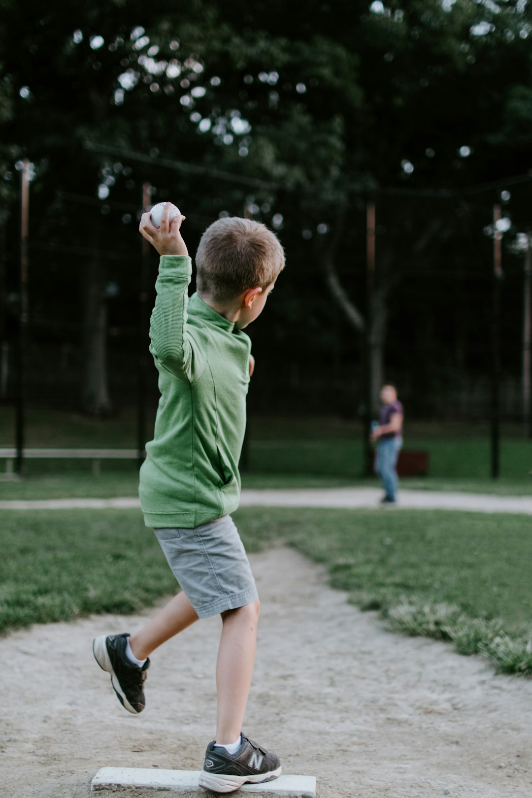 boy about to throw ball outdoors