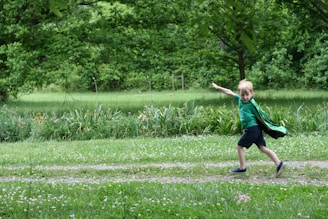 A colorful storybook page featuring a child hero with a cape and a magical forest background.