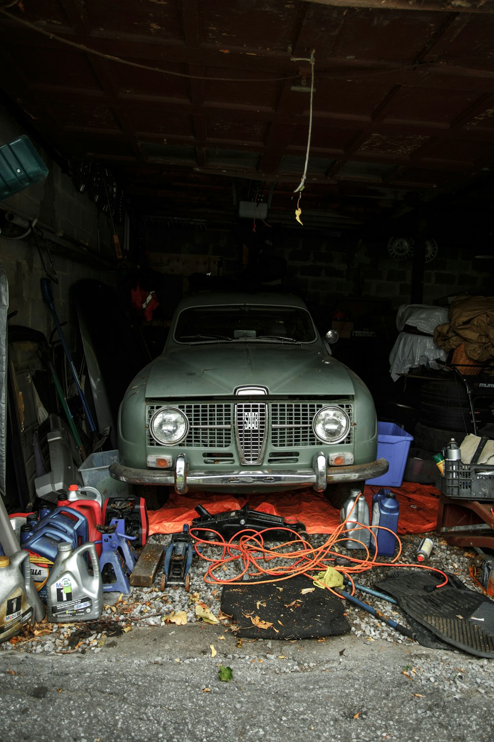 green vehicle inside garage