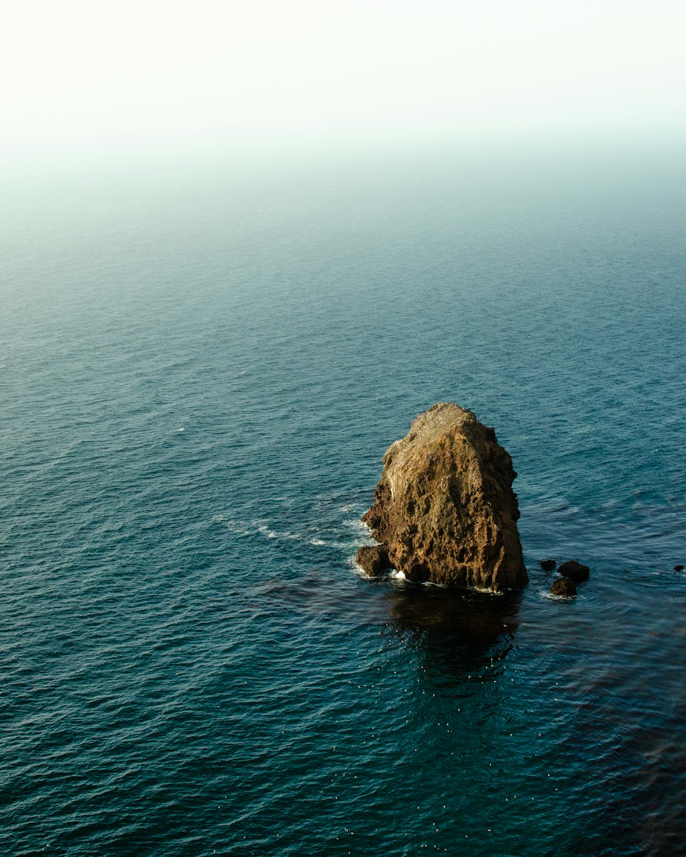 rock formation on body of water