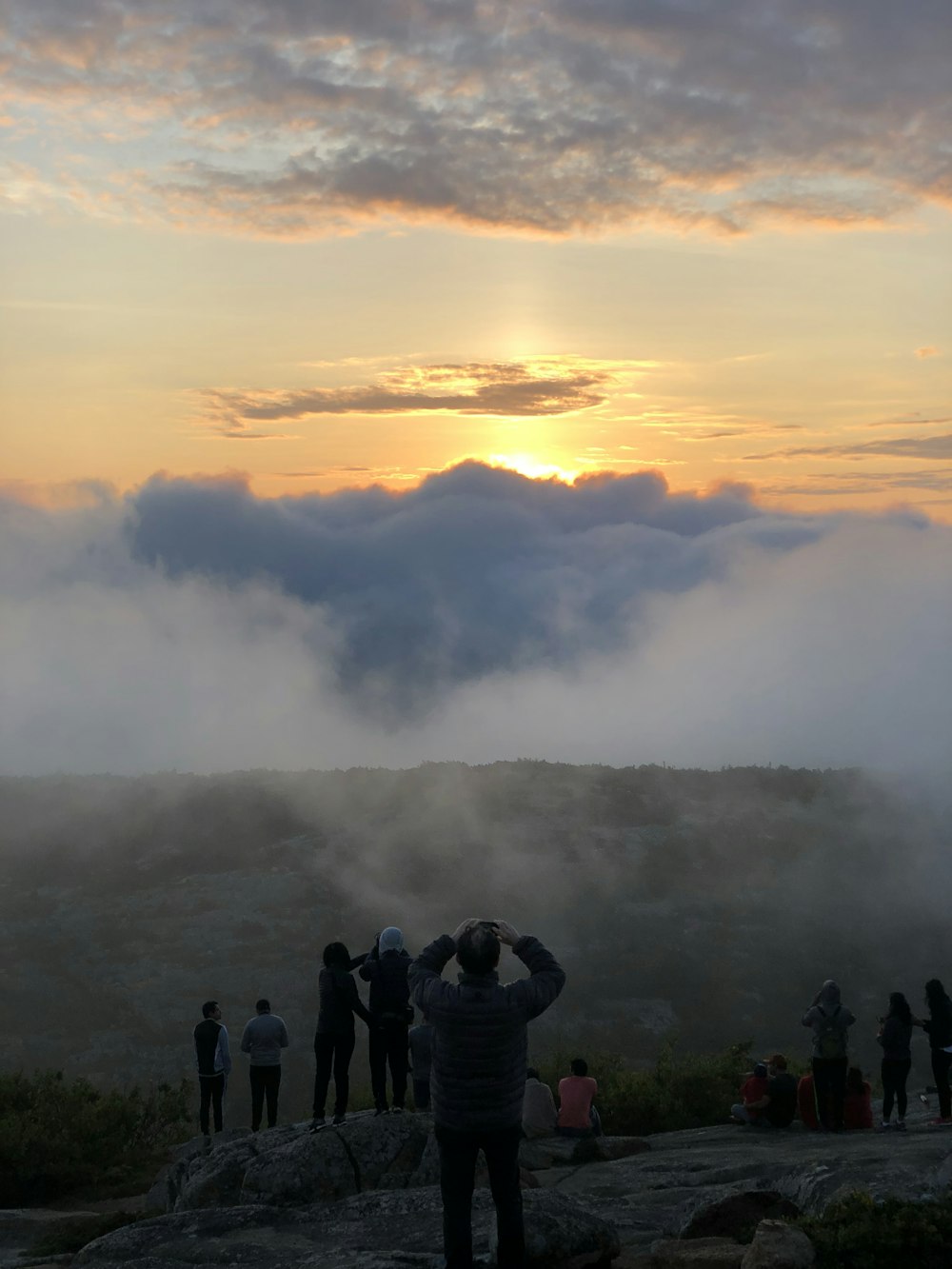 group of people near fog