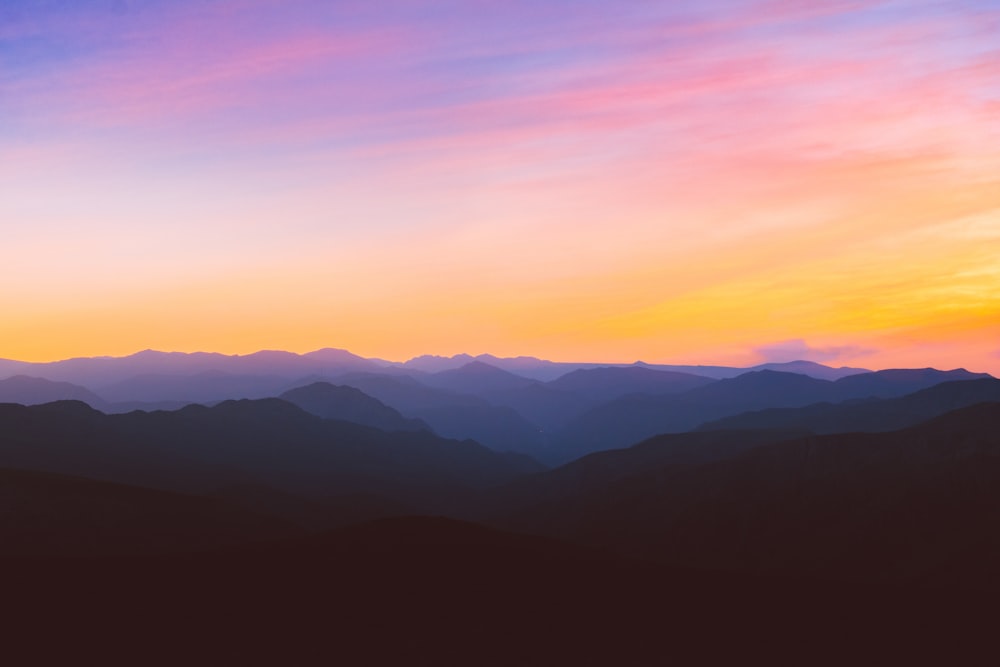 silhouette photo of mountain during golden hour