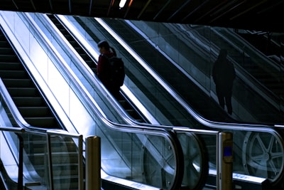 woman standing at escalator netherlands google meet background