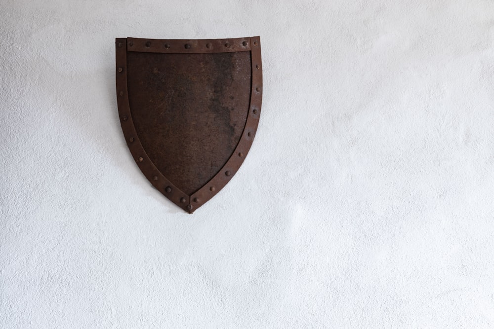 brown metal shield wall decor