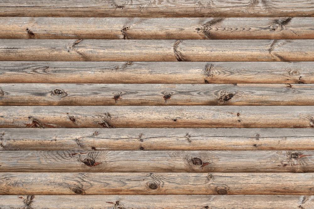 a close up of a wooden wall made of logs
