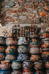 assorted-color clay pots arranged together
