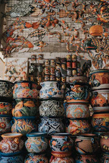 assorted-color clay pots arranged together
