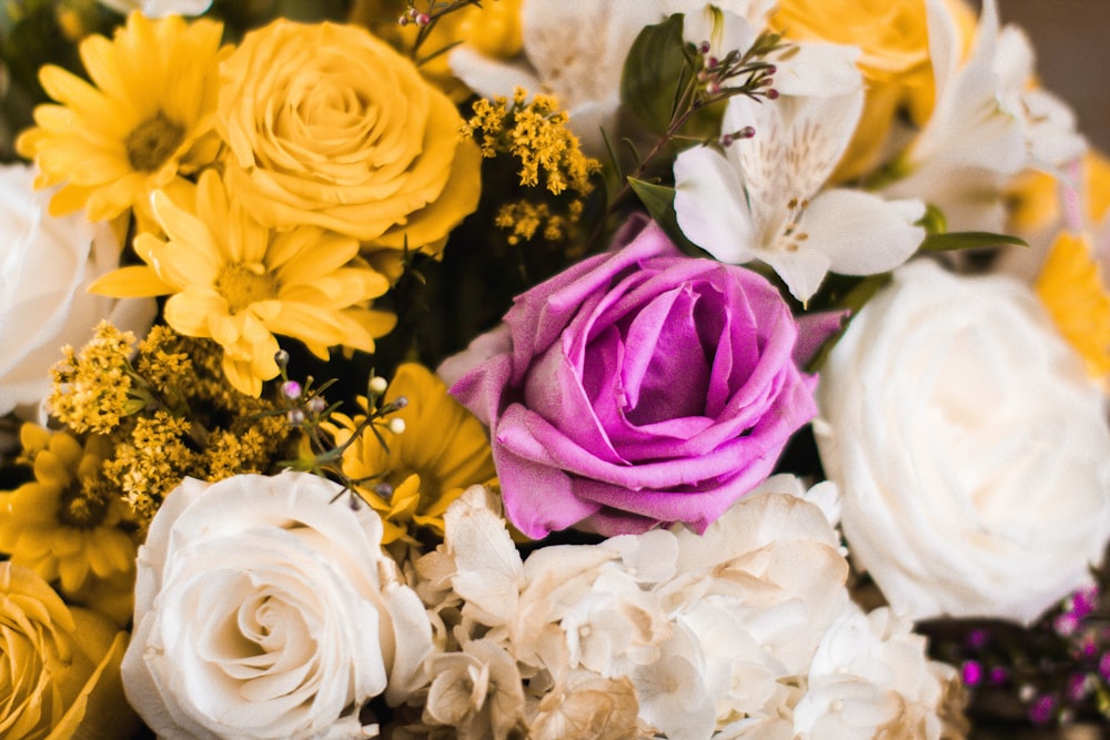 yellow, white, and purple flower arrangment