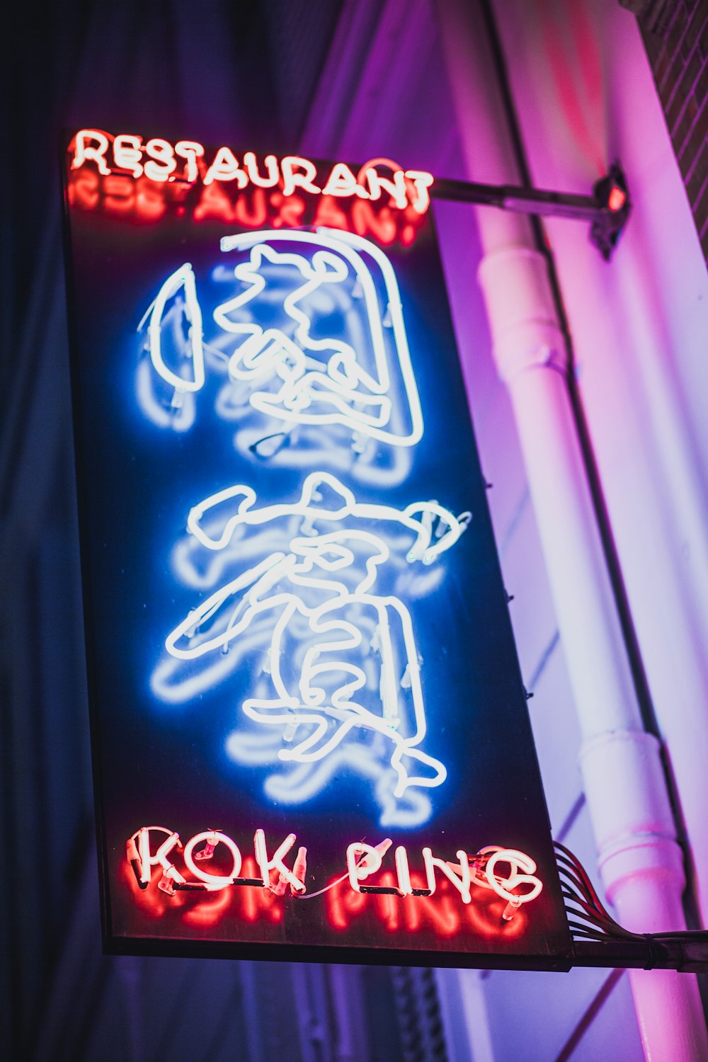 blue and red neon light signage at night