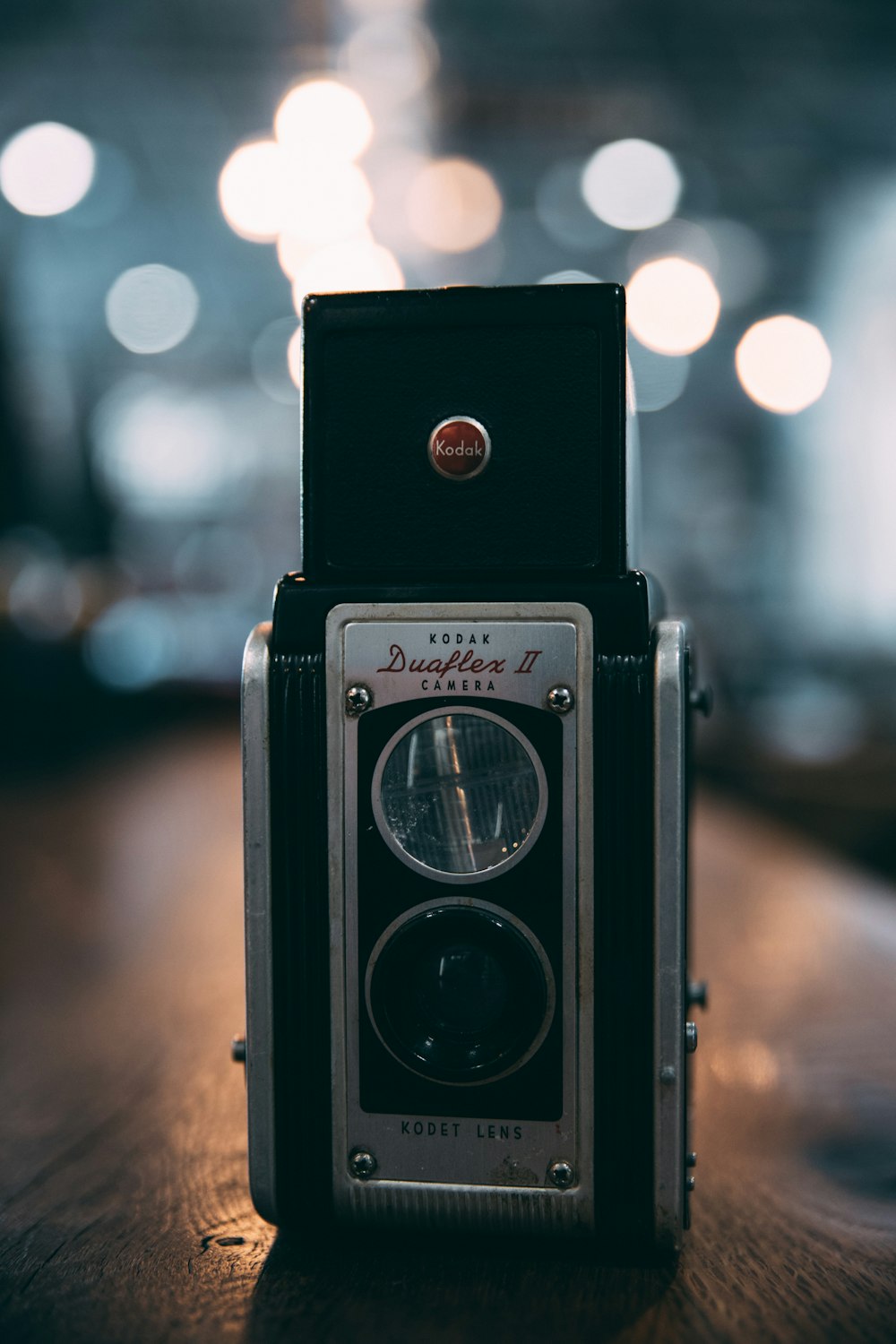 black and gray two-lens camera in selective focus photography