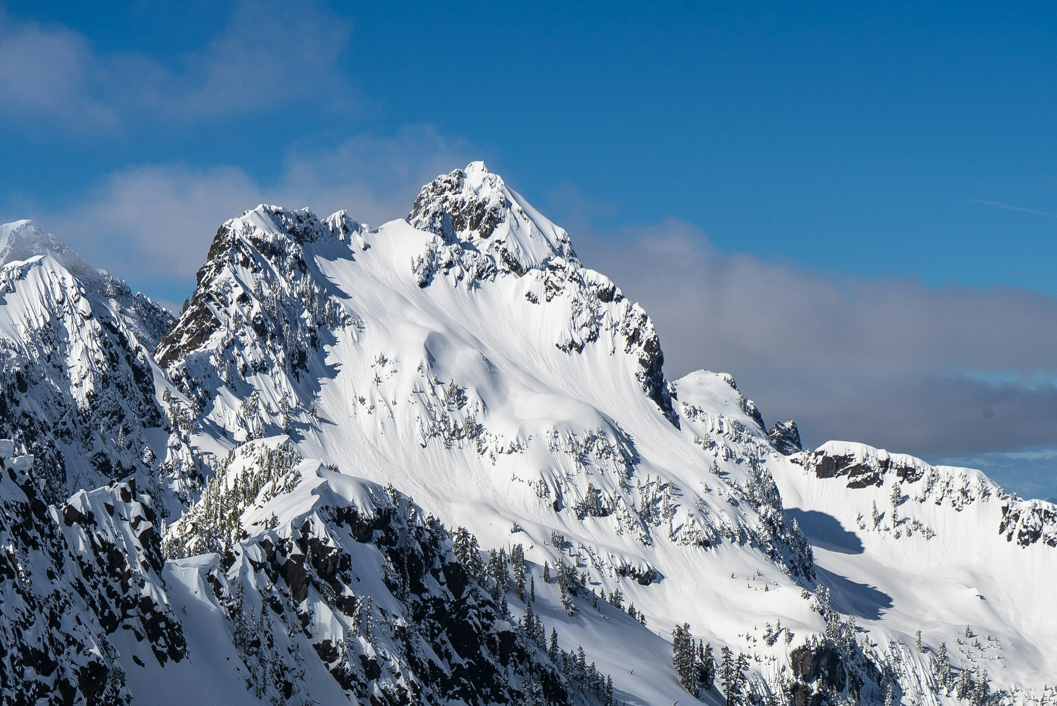 black mountain covered with snow