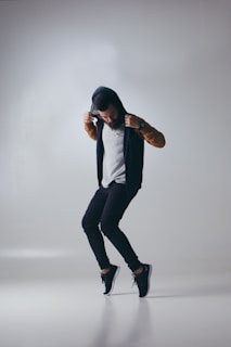 man wearing black hooded jacket