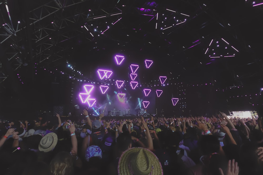 people watching blue triangle stage lights